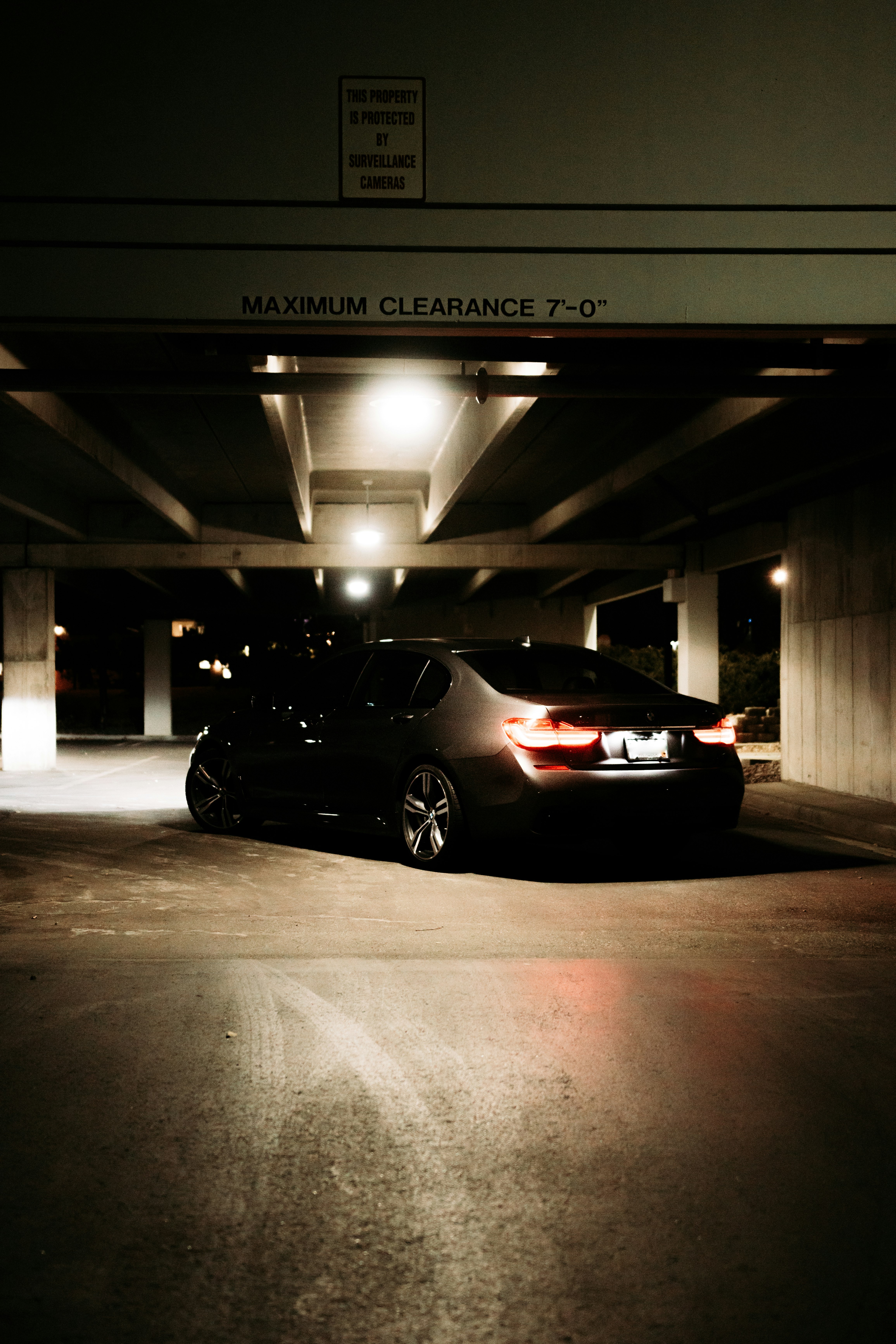 black sedan parked on parking lot